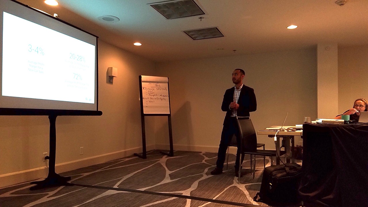 Eric Dumlao presenting at a Dealer Inspire meeting